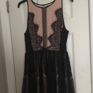 Nude and black midi dress